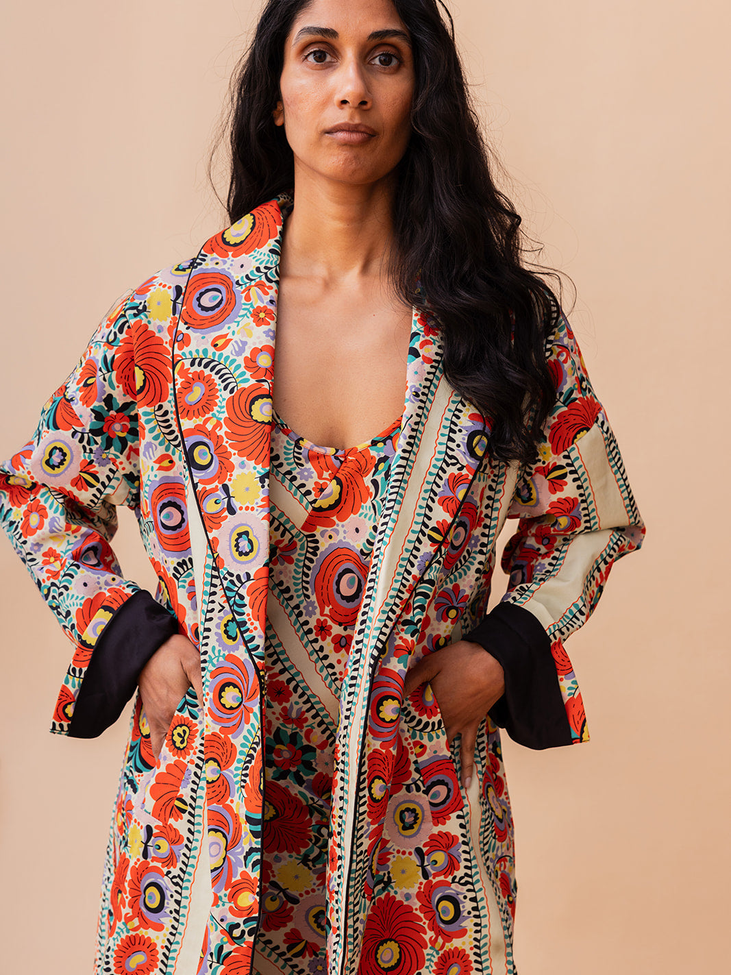 Front view worn open with the cuffs turned back, Matyó Floral brushed cotton car coat