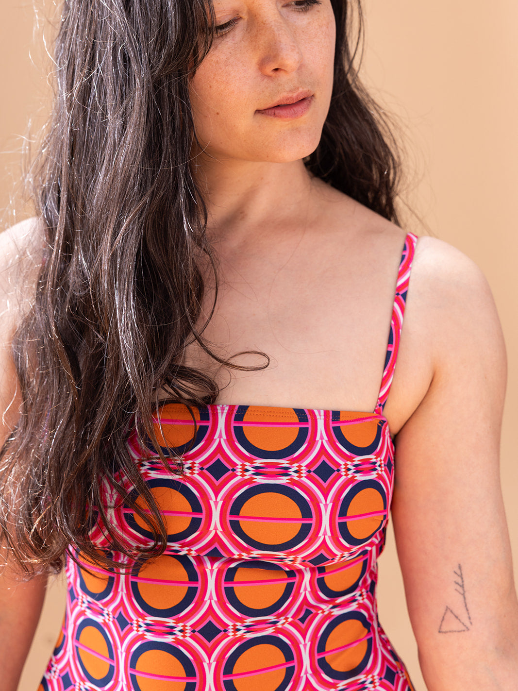 Close-up of the straight neckline and spaghetti straps, Moon Illusion recycled nylon swimsuit