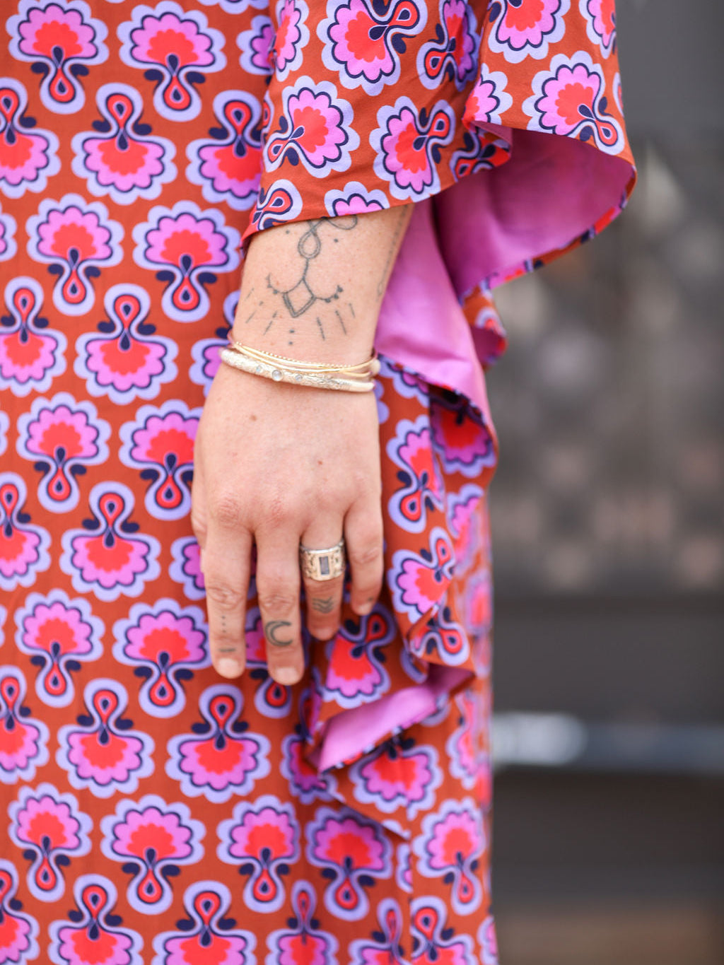 Close-up of the sleeve and its pink lining, Dahlia Seed matte viscose kaftan